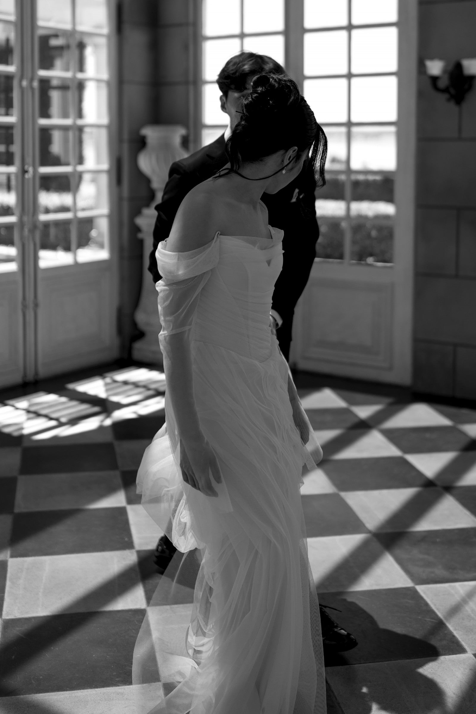 Elegant White Off-the-Shoulder Ruched Tulle Train Wedding Dress
